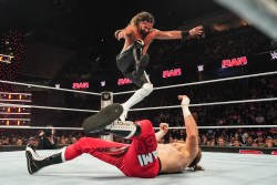 EVERETT, WASHINGTON - DECEMBER 2: Seth Rollins attempts a Curb Stomp against Sami Zayn during Monday Night RAW at Angel of the Winds Arena on December 2, 2024 in Everett, Washington.  (Photo by WWE/Getty Images)