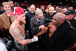 ARLINGTON, TEXAS - NOVEMBER 15: (L-R) Jake Paul announced as winner against Mike Tyson during LIVE On Netflix: Jake Paul vs. Mike Tyson at AT&T Stadium on November 15, 2024 in Arlington, Texas. (Photo by Al Bello/Getty Images for Netflix © 2024)