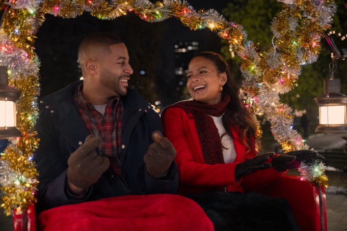 Meet Me Next Christmas. (L to R) Devale Ellis as Teddy and Christina Milian as Layla in Meet Me Next Christmas. Cr. Sophie Giraud/Netflix © 2024.